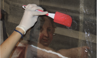 Particolare del restauro della tela Il martirio di San Giacomo rivelato di Tarquinio Grassi.